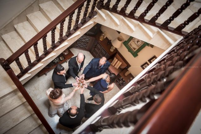 Groom's family having a toast prior to leaving for wedding in Gozo