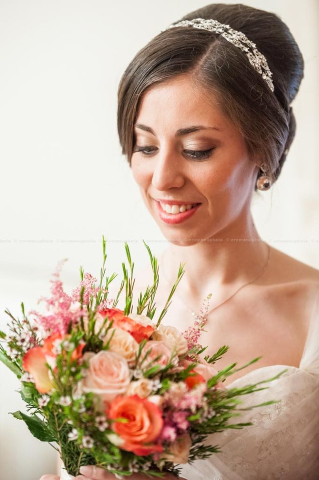 Bride admiring her flower bouquet