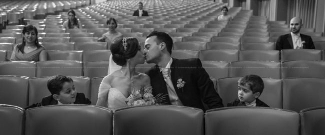 Bride and groom kissing during a post wedding shoot at the Aurora theater in Victoria, Gozo